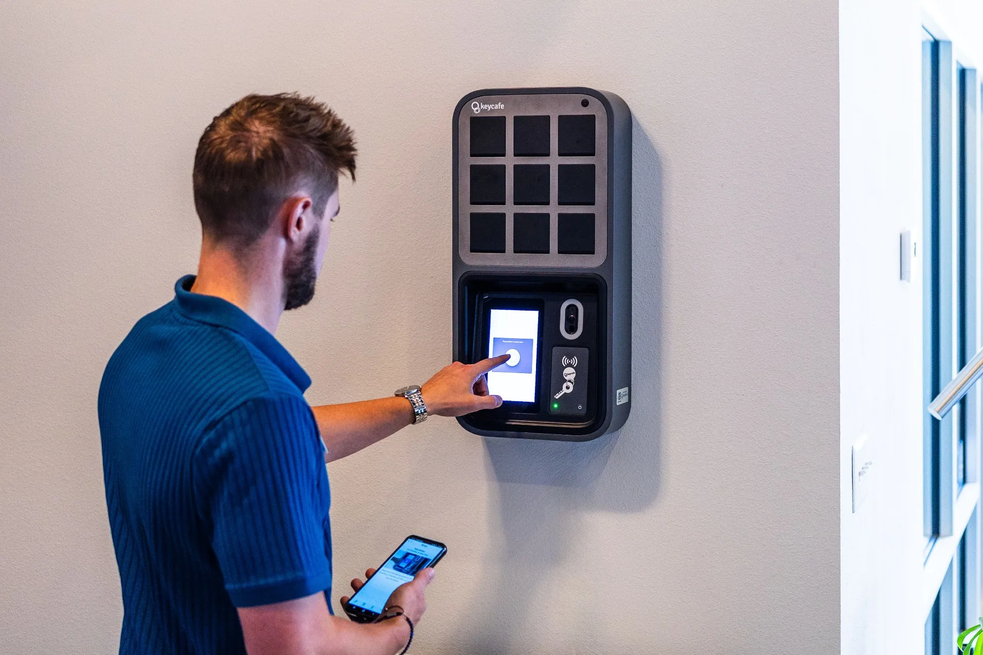 TLC Properties staff member tapping the SmartBox screen