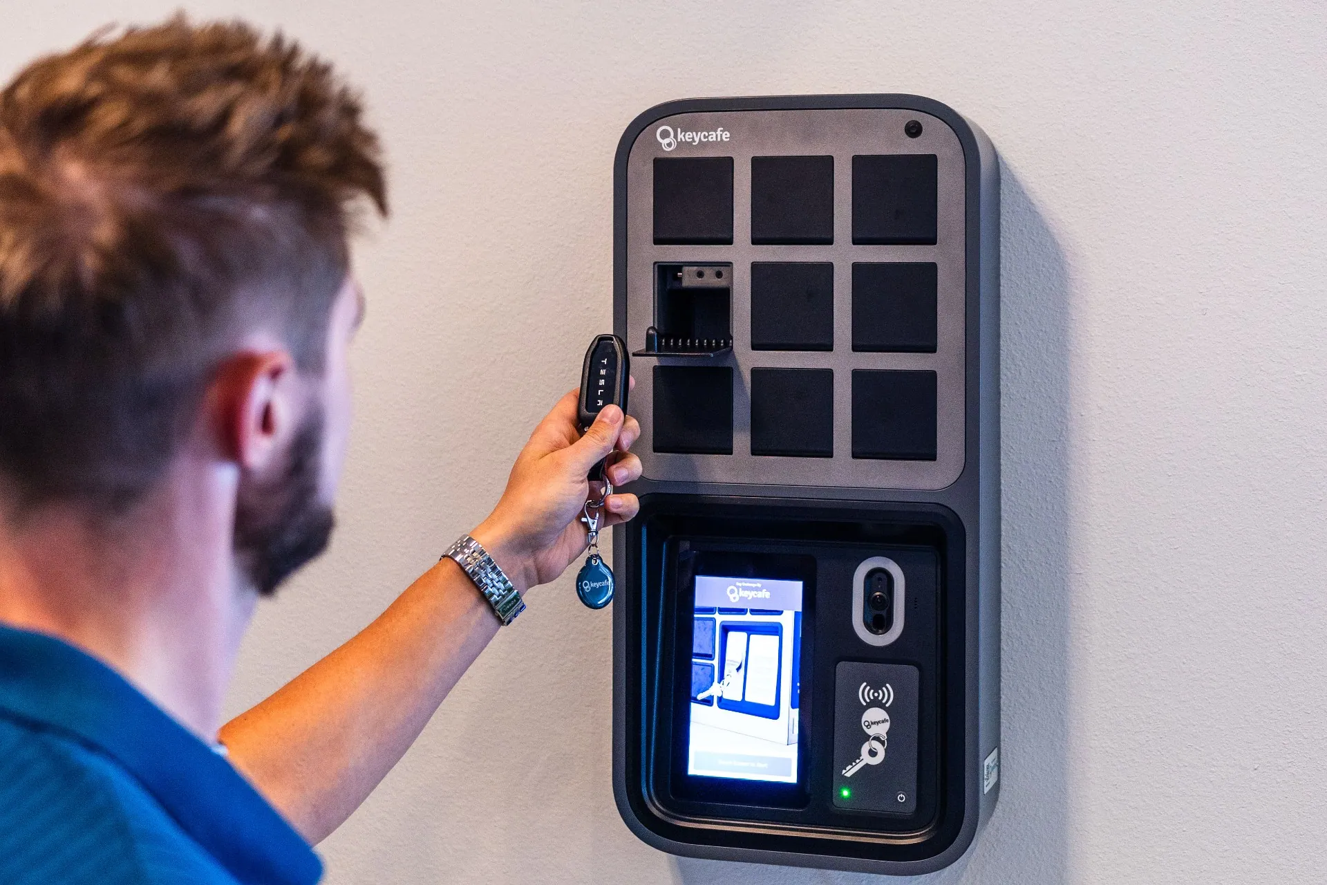 TLC Properties staff member taking keys from the SmartBox