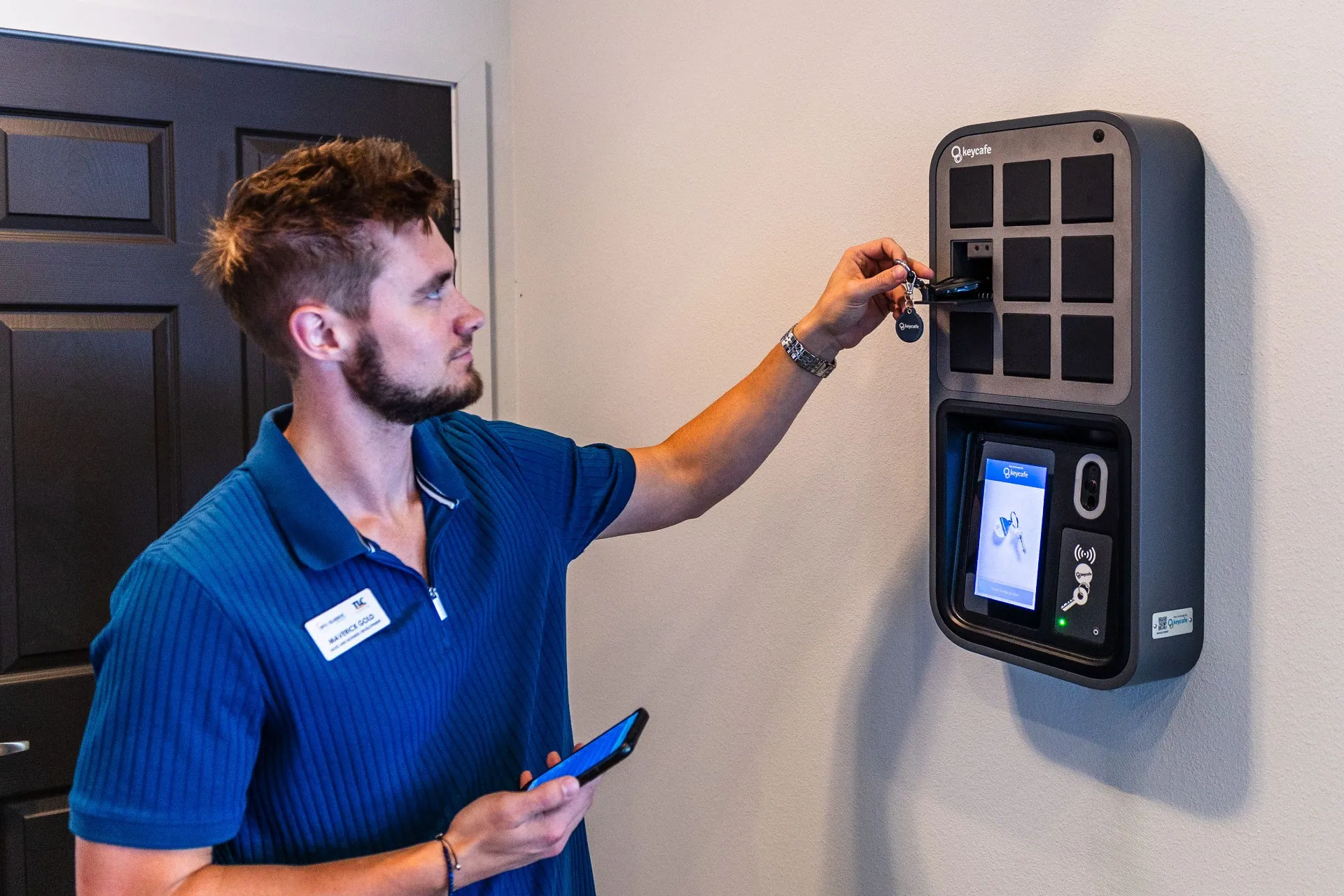 TLC Properties employee returning keys to a SmartBox bin