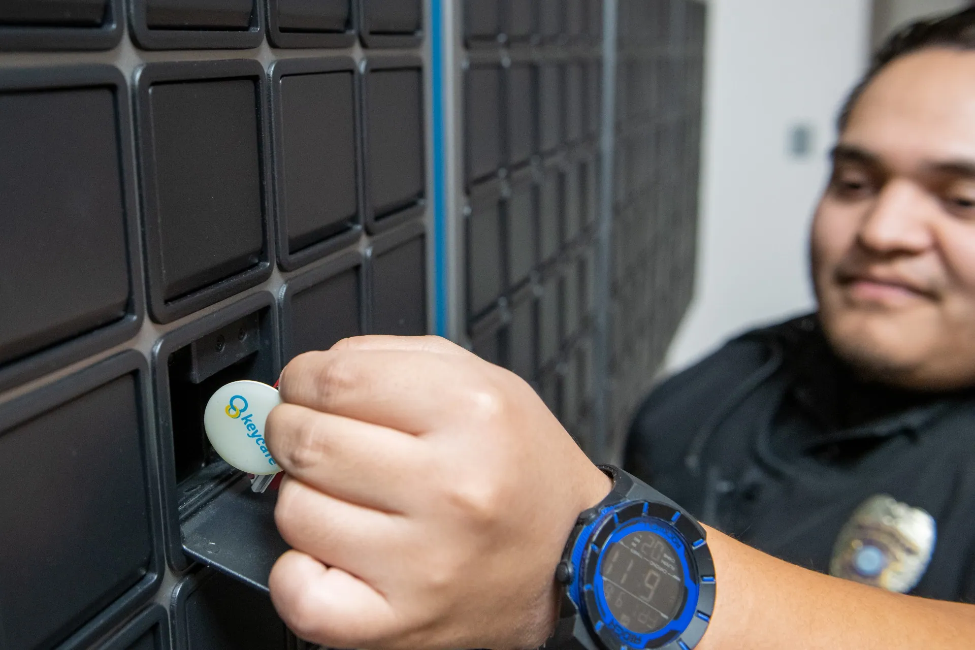 Close up of an Aransas Pass PD officer taking keys from an open SmartBox bin