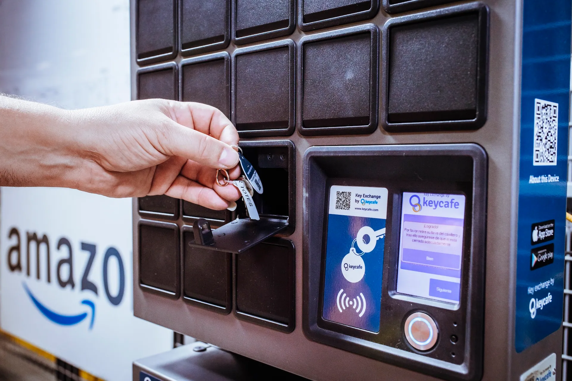 Amazon employee taking keys from an open SmartBox bin