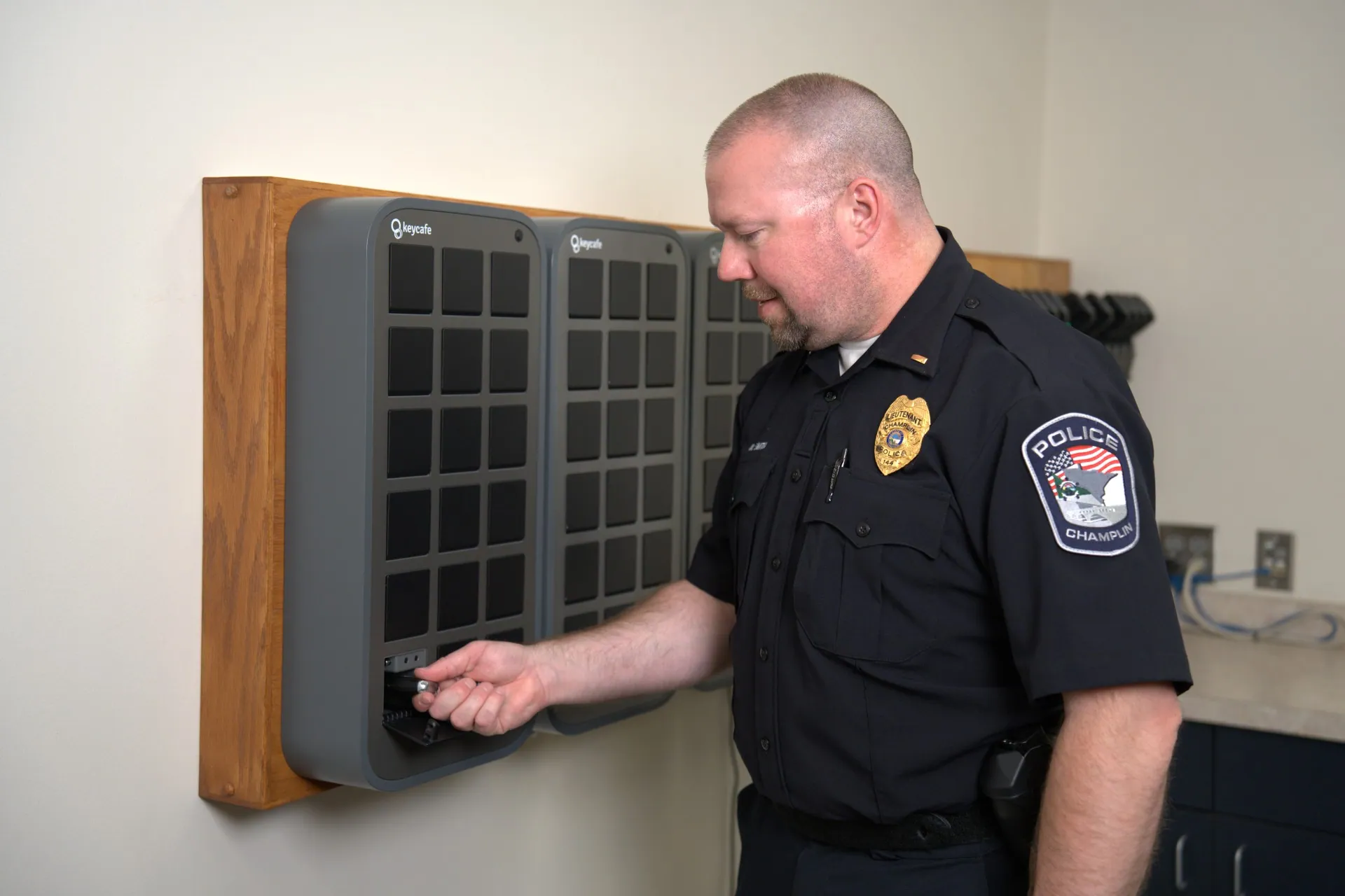 Champlin Police Department Lieutenant Matt Smith taking keys from a SmartBox bin