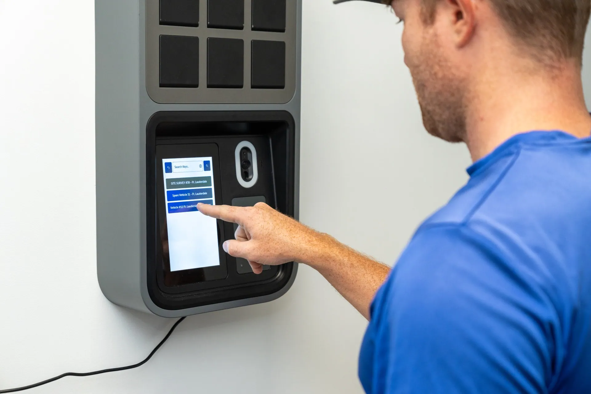SunVena Solar staff member selecting a key on the SmartBox screen